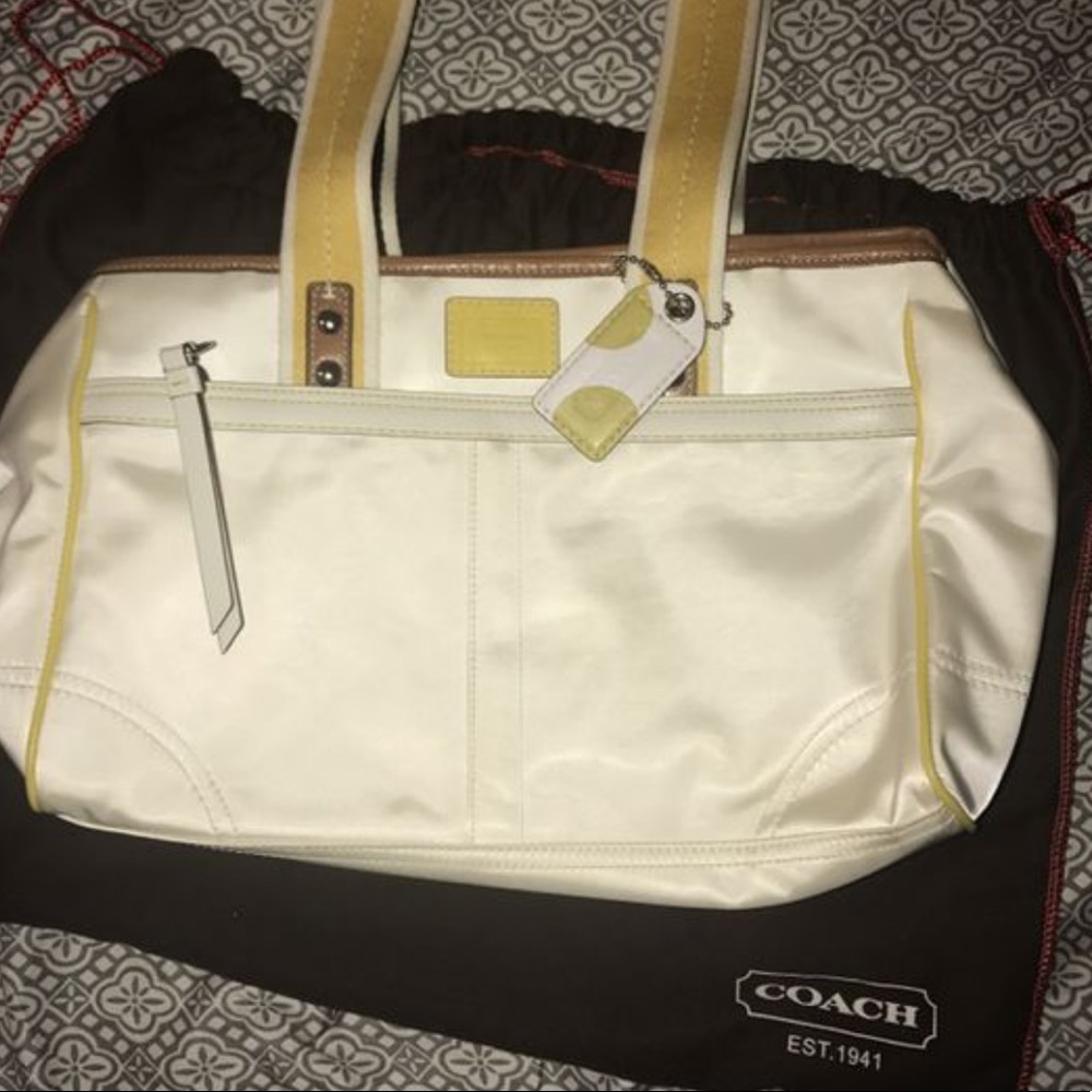 White and yellow coach purse